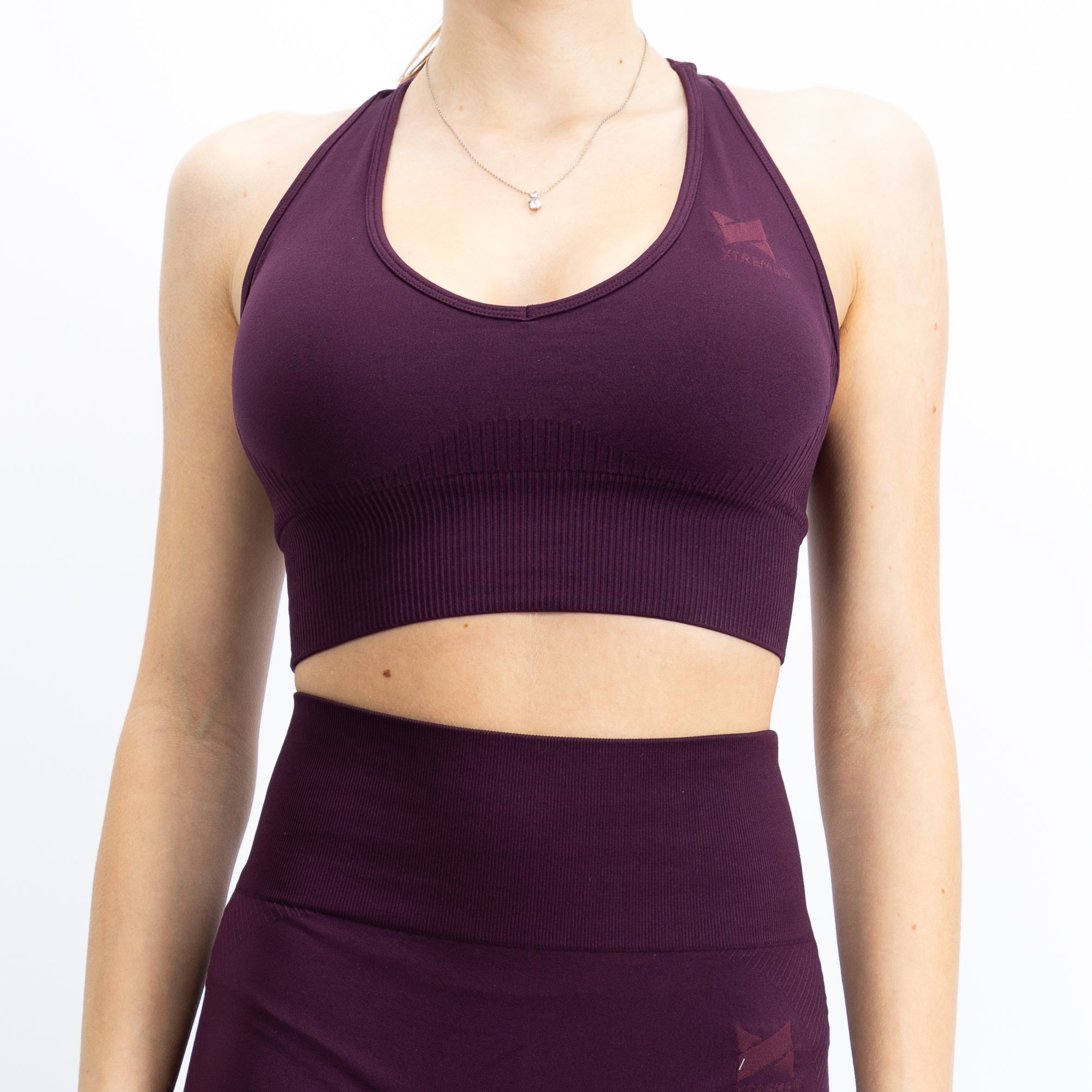 Top de desporto, na cor bordô, para mulher. Top com bom suporte no peito.
Perfeito para atividades de alto desempenho.
